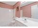 Cozy bathroom with combined tub and shower unit, and a vanity sink at 219 Garden W Walk, Hampton, GA 30228