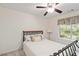 Cozy bedroom with a view, and an iron bed frame at 219 Garden W Walk, Hampton, GA 30228