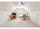 Bright bonus room with vaulted ceilings, neutral carpet, and multiple closets at 219 Garden W Walk, Hampton, GA 30228