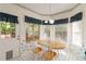 Bright breakfast nook with a wood table and large windows at 219 Garden W Walk, Hampton, GA 30228