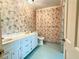 Bathroom with palm tree wallpaper and vanity at 2603 Kings Lake Ne Ct, Atlanta, GA 30345