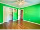 Bedroom featuring hardwood floors, neutral walls, and a closet with bi-fold doors providing storage solutions at 2603 Kings Lake Ne Ct, Atlanta, GA 30345