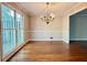 Elegant dining room with hardwood floors, chandelier, and natural light at 2603 Kings Lake Ne Ct, Atlanta, GA 30345