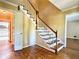Inviting foyer with hardwood floors and stairs leading to the upper level at 2603 Kings Lake Ne Ct, Atlanta, GA 30345