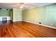 Living room with hardwood flooring, ceiling fan, and built-ins at 2603 Kings Lake Ne Ct, Atlanta, GA 30345
