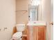 Well-lit half-bathroom with tile flooring, and single sink at 6396 Phillips Ct, Lithonia, GA 30058