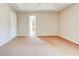 Large, sunny bedroom with neutral walls, carpet, and ceiling fan; ready for your personal design at 6396 Phillips Ct, Lithonia, GA 30058