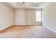 Bright, spacious bedroom with natural light and neutral tones, offering a blank canvas for your personal touch at 6396 Phillips Ct, Lithonia, GA 30058