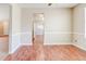 Dining room features hardwood floors, modern trim, and a view into the kitchen at 6396 Phillips Ct, Lithonia, GA 30058