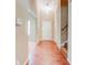 Bright foyer with hardwood flooring, a pendant light, and staircase at 6396 Phillips Ct, Lithonia, GA 30058