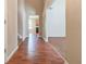 The foyer features a hardwood floor, view of a kitchen and nearby living spaces at 6396 Phillips Ct, Lithonia, GA 30058