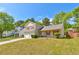 Attractive two-story home with red shutters, a two-car garage, and green lawn at 6396 Phillips Ct, Lithonia, GA 30058