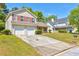 Charming two-story home featuring an attached two-car garage and a mailbox at 6396 Phillips Ct, Lithonia, GA 30058
