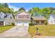 Inviting two-story home with attached two-car garage and well-maintained front lawn at 6396 Phillips Ct, Lithonia, GA 30058