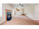 Open living room with fireplace and view into kitchen at 6396 Phillips Ct, Lithonia, GA 30058