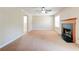 Spacious living room featuring a fireplace and ample natural light at 6396 Phillips Ct, Lithonia, GA 30058