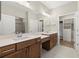 Spacious bathroom features dual sinks with wood cabinets and a large mirror, plus a walk-in closet at 809 Kirby Dr, Woodstock, GA 30188