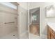 The Primary bathroom features a step-in shower, neutral tile, and a view of the main bedroom at 809 Kirby Dr, Woodstock, GA 30188