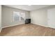 Bedroom with hardwood flooring, closet and large window at 809 Kirby Dr, Woodstock, GA 30188