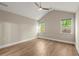 An empty bedroom with hardwood floors, recessed lighting, and multiple windows for ample natural light at 809 Kirby Dr, Woodstock, GA 30188