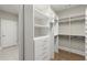 Walk-in closet offering abundant storage space with custom shelving and drawers at 809 Kirby Dr, Woodstock, GA 30188