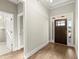 Bright foyer featuring hardwood floors and a view of the front door at 809 Kirby Dr, Woodstock, GA 30188