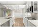 Gourmet kitchen featuring stainless appliances, granite counters, and a gas range at 809 Kirby Dr, Woodstock, GA 30188