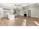 Spacious living room with hardwood floors, fireplace, and a kitchen island at 809 Kirby Dr, Woodstock, GA 30188
