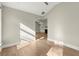 View of a cozy living room showcasing hardwood floors and natural light with a fireplace at 809 Kirby Dr, Woodstock, GA 30188