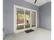 Covered patio with sliding glass doors offers a seamless transition to the outdoors at 809 Kirby Dr, Woodstock, GA 30188