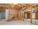Unfinished basement with exposed ceiling and studded walls offers potential for customization at 850 Madison Chase Way, Lawrenceville, GA 30045