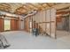Spacious unfinished basement featuring studded walls and a window for natural light at 850 Madison Chase Way, Lawrenceville, GA 30045