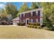 Traditional two-story home with a manicured lawn, landscaping, and an attached two car garage at 850 Madison Chase Way, Lawrenceville, GA 30045