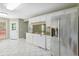 Spacious kitchen with white cabinetry, stainless steel appliances, and a sunny breakfast nook at 850 Madison Chase Way, Lawrenceville, GA 30045