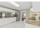 Bright kitchen with white cabinetry, granite countertops, and stainless steel refrigerator at 850 Madison Chase Way, Lawrenceville, GA 30045