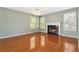 Inviting living room with hardwood floors, light green walls, and a cozy fireplace at 850 Madison Chase Way, Lawrenceville, GA 30045