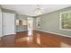 Bright living room featuring hardwood floors, a ceiling fan and natural light at 850 Madison Chase Way, Lawrenceville, GA 30045