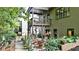 Private backyard showcasing a patio with an outdoor seating area and lush garden landscaping at 117 Manous Dr, Canton, GA 30115