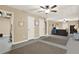 Spacious finished basement with two rugs, drop ceiling, fan, and neutral paint ready for entertaining and recreation at 117 Manous Dr, Canton, GA 30115