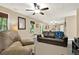 Spacious finished basement area with plush leather seating, natural light, and neutral paint for a relaxing retreat at 117 Manous Dr, Canton, GA 30115