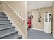 Finished basement area with painted stairs and various mechanical and storage items at 117 Manous Dr, Canton, GA 30115