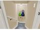 Basement stairway showcasing neutral walls, with a view of the finished basement area at 117 Manous Dr, Canton, GA 30115