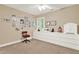 Bright bedroom featuring a sewing machine and plenty of space for storage and hobbies at 117 Manous Dr, Canton, GA 30115