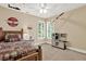 bedroom with neutral colored walls, white trim, shutters, ceiling fan and playful airplane decor throughout at 117 Manous Dr, Canton, GA 30115