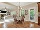 Charming dining area features hardwood floors and access to an outdoor deck, perfect for entertaining at 117 Manous Dr, Canton, GA 30115