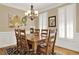 Traditional dining room with wood table, plantation shutters, and decorative lighting at 117 Manous Dr, Canton, GA 30115