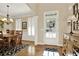 Bright dining room with hardwood floors, white trim, and stylish chandelier at 117 Manous Dr, Canton, GA 30115