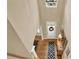View of the foyer featuring hardwood floors, a decorative wreath on the front door, and neutral wall paint at 117 Manous Dr, Canton, GA 30115