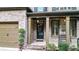 Charming brick front porch with stately columns and a welcoming entrance with neutral accents at 117 Manous Dr, Canton, GA 30115