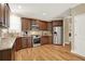 Spacious kitchen with stainless steel appliances, granite countertops, hardwood floors, and ample cabinet space at 117 Manous Dr, Canton, GA 30115